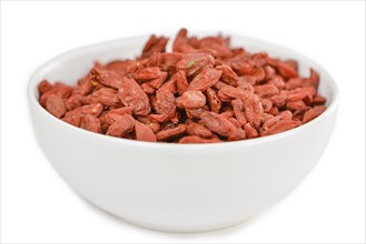 Goji Berries (dried) isolated on white background (selective focus, close-up shot)