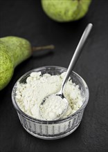 Portion of Pear powder as detailed close-up shot, selective focus