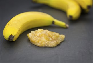 Mashed Bananas (selective focus, close-up shot) on a vintage background