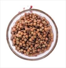 Preserved Pink Peppercorns isolated on white background, selective focus, close-up shot