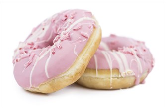 Some fresh made Donuts isolated on white background (close-up shot)