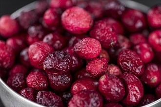 Portion of fresh made Dried Cranberries on a slate slab (selective focus)