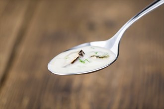 Homemade Porcini Soup on vintage background selective focus, close-up shot