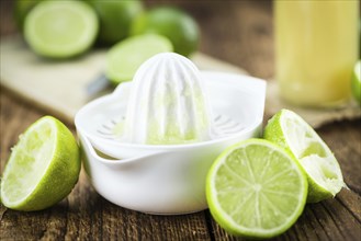 Lime Juice on a vintage background as detailed close-up shot (selective focus)