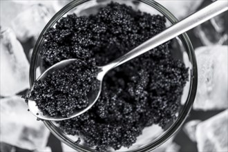 Portion of fresh Black Caviar (selective focus, close-up shot)