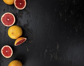 Chopped Grapefruits (selective focus) on a vintage background as detailed close-up shot