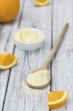 Portion of fresh made Orange Powder as detailed close-up shot (selective focus)
