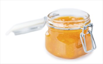 Portion of fresh made Apricot Jam isolated on white background