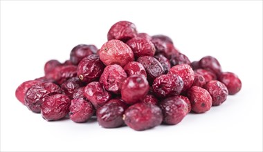 Dried Cranberries as detailed close-up shot isolated on white background (selective focus)