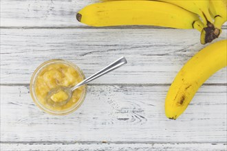 Mashed Bananas on a vintage background as detailed close-up shot (selective focus)