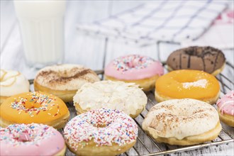 Portion of some Donuts as detailed close-up shot (fresh made, selective focus)