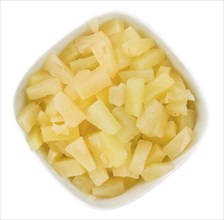 Fresh made Chopped Pineapple (preserved) isolated on white background, close-up shot