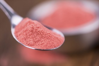 Fresh made Strawberry powder on an old and rustic wooden table, selective focus, close-up shot