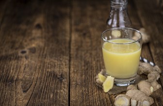 Portion of fresh Ginger Juice (selective focus, close-up shot)