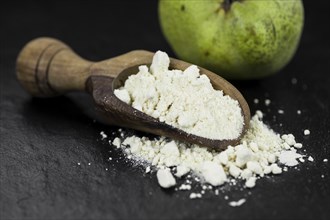 Fresh made Pear powder on a slate slab (close-up shot, selective focus)