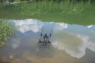 Fishing rod holder with automatic motion detector in a reservoir, Bavaria, Germany, Europe