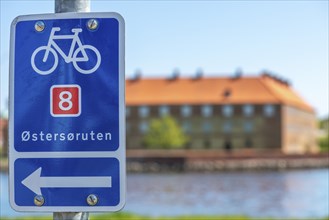 Sonderborg, Als, Sonderburg, cyclist, Ostersoruten 8 sign, Baltic Sea Cycle Route 8, brick building