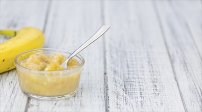 Mashed Bananas (selective focus, close-up shot) on a vintage background