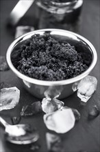 Portion of fresh Black Caviar (selective focus, close-up shot)