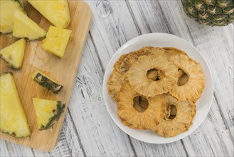 Some homemade Dried Pineapple Rings as detailed close-up shot, selective focus