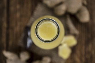 Portion of fresh Ginger Juice (selective focus, close-up shot)