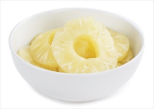 Portion of Preserved Pineapple Rings as detailed close-up shot isolated on white background