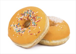 Some fresh made Donuts isolated on white background (close-up shot)