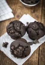 Fresh Chocolate Muffins as detailed close-up shot (selective focus)