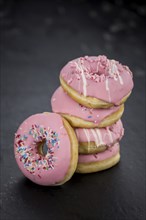 Portion of some Donuts as detailed close-up shot (fresh made, selective focus)