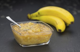 Mashed Bananas (on a vintage slate slab) as detailed close-up shot