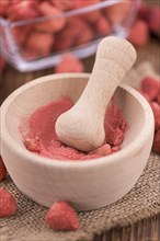 Fresh made Strawberry powder on a vintage background as detailed close-up shot