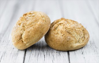 Rolls (German style) on rustic wooden background as close-up shot