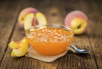 Peach Jam on a vintage background as detailed close-up shot, selective focus