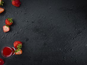 Some homemade Strawberry liqueur as detailed close-up shot, selective focus