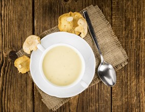 Fresh made Chanterelle Soup on a vintage background as detailed close-up shot