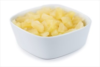 Portion of Preserved Pineapple pieces as detailed close-up shot isolated on white background