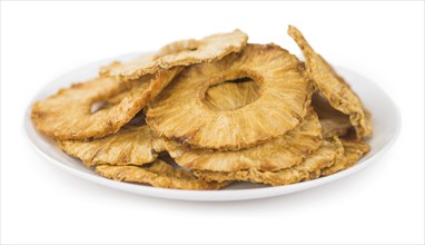 Portion of Dried Pineapple Rings as detailed close-up shot isolated on white background