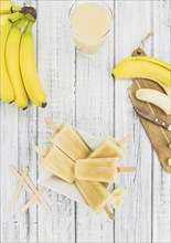 Banana Popsicles on a vintage background (close-up shot, selective focus)