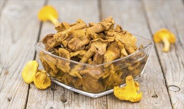 Canned chanterelles on a vintage background as detailed close-up shot, selective focus