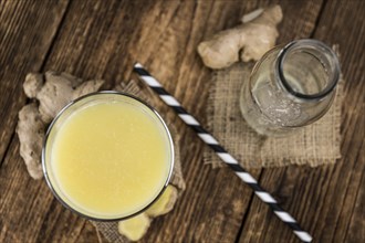 Portion of healthy Ginger Drink (selective focus, close-up shot)