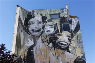 Figure with three different heads, mural by Greek street artist Vasmou, entitled Superman, Psirri