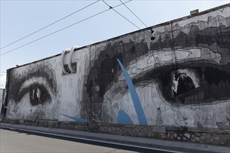 Giant pair of eyes on a wall, mural by Greek street artist INO, Gazi neighbourhood, Athens, Greece,