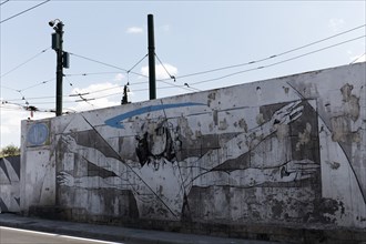 Vitruvian Man after the drawing by Leonardo da Vinci, mural by Greek street artist INO, Gazi