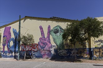 Graffiti with various gestures, Victory hand signs, street art in the Gazi neighbourhood, Athens,