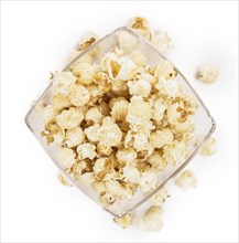 Fresh made Popcorn isolated on white background, close-up shot