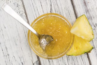 Fresh made Pineapple Jam on a vintage background as detailed close-up shot