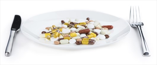 Drugs prepared as meal (close-up shot, selective focus) isolated on white background