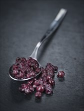 Preserved Blueberries on a vintage background as detailed close-up shot, selective focus