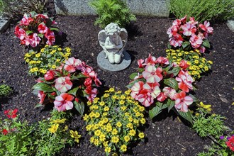 Grave with floral decoration and cherub, Allgäu, Swabia, Bavaria, Germany, Europe