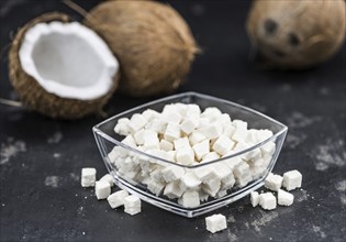 Portion of healthy Coconut dices (selective focus, close-up shot)